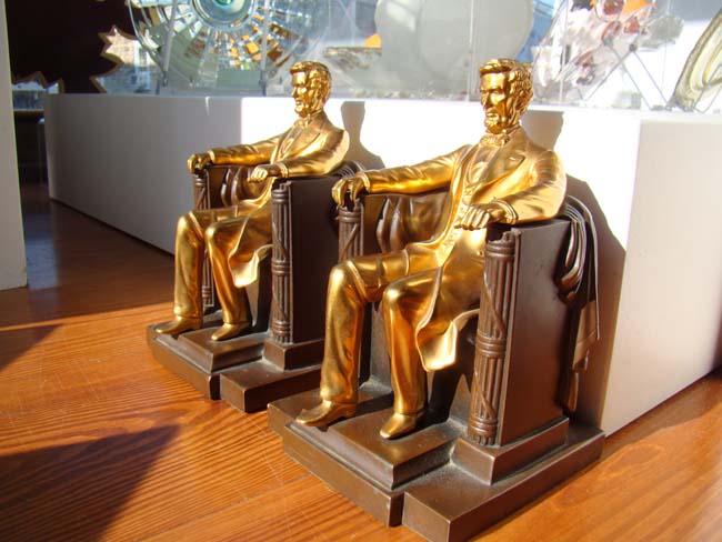 A pair of Mint condition "Lincoln in the Chair" bookends made by Jennings Brothers circa 1935
